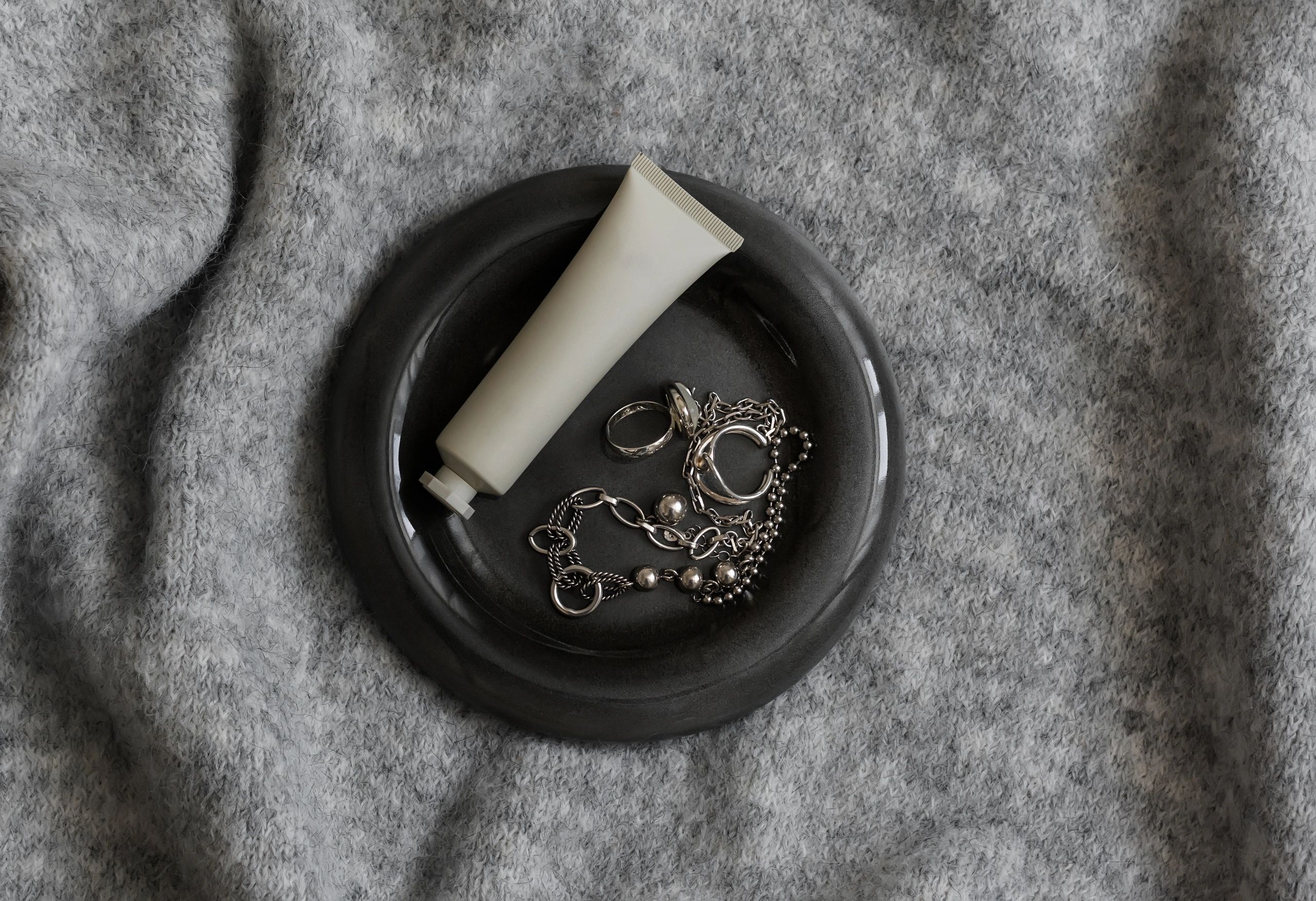 Minimal jewelry flat lay used as testimonial avatar image