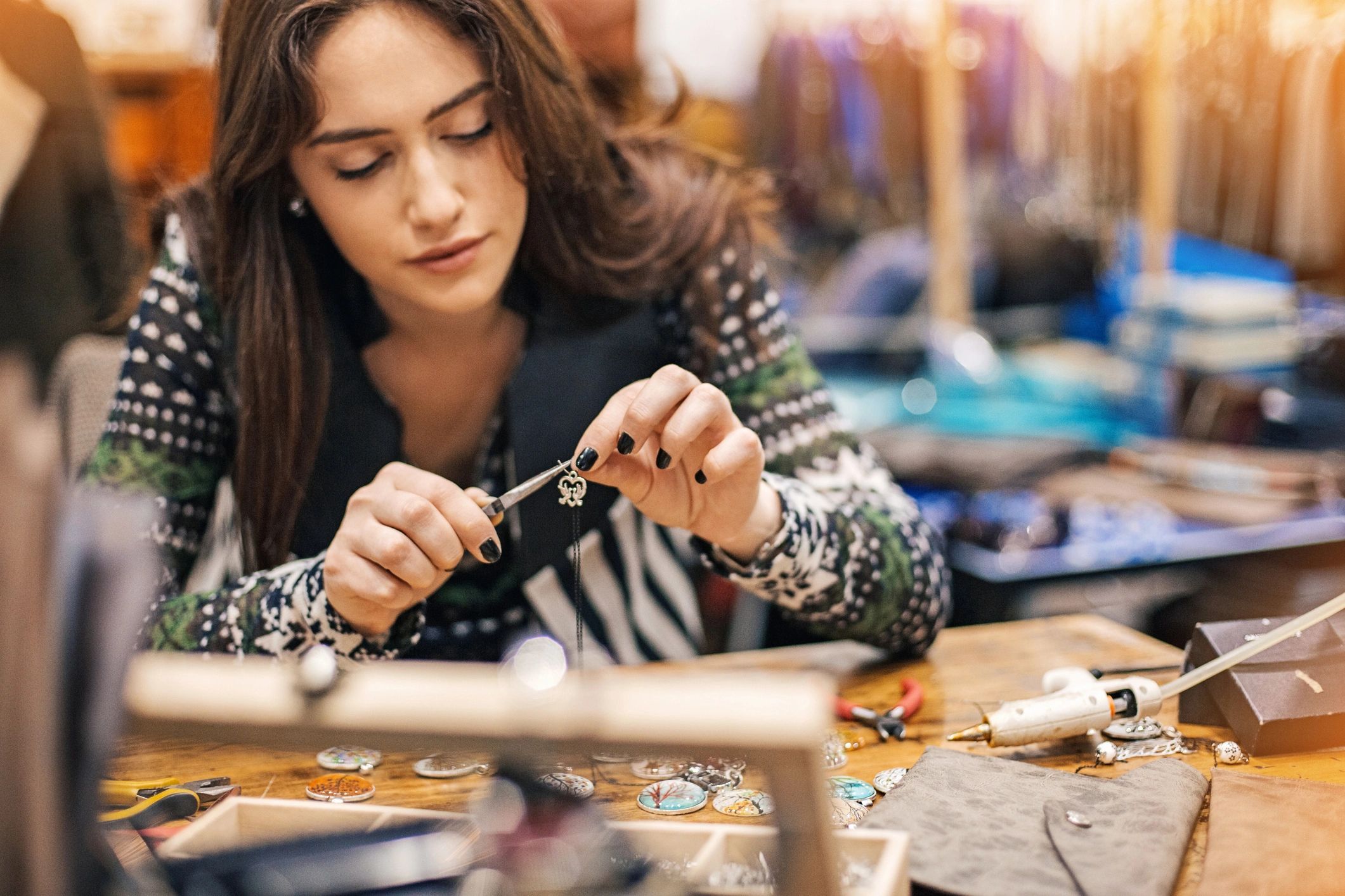 Jewelry maker working in a studio.